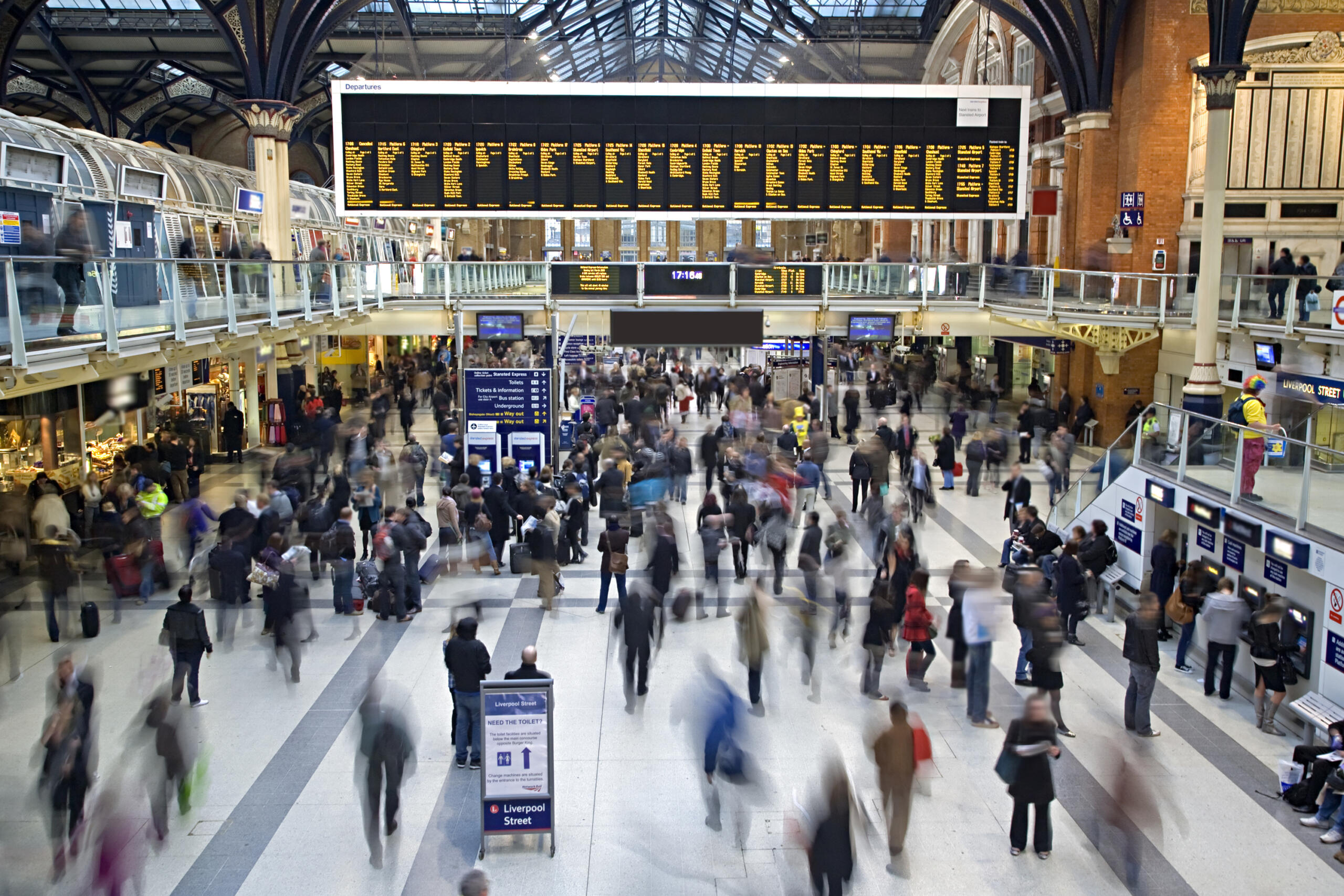 Aerial photo of the inside of a train station packed with people
