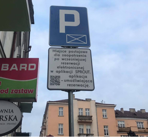 Photo from below of a street sign indicating street parking rules