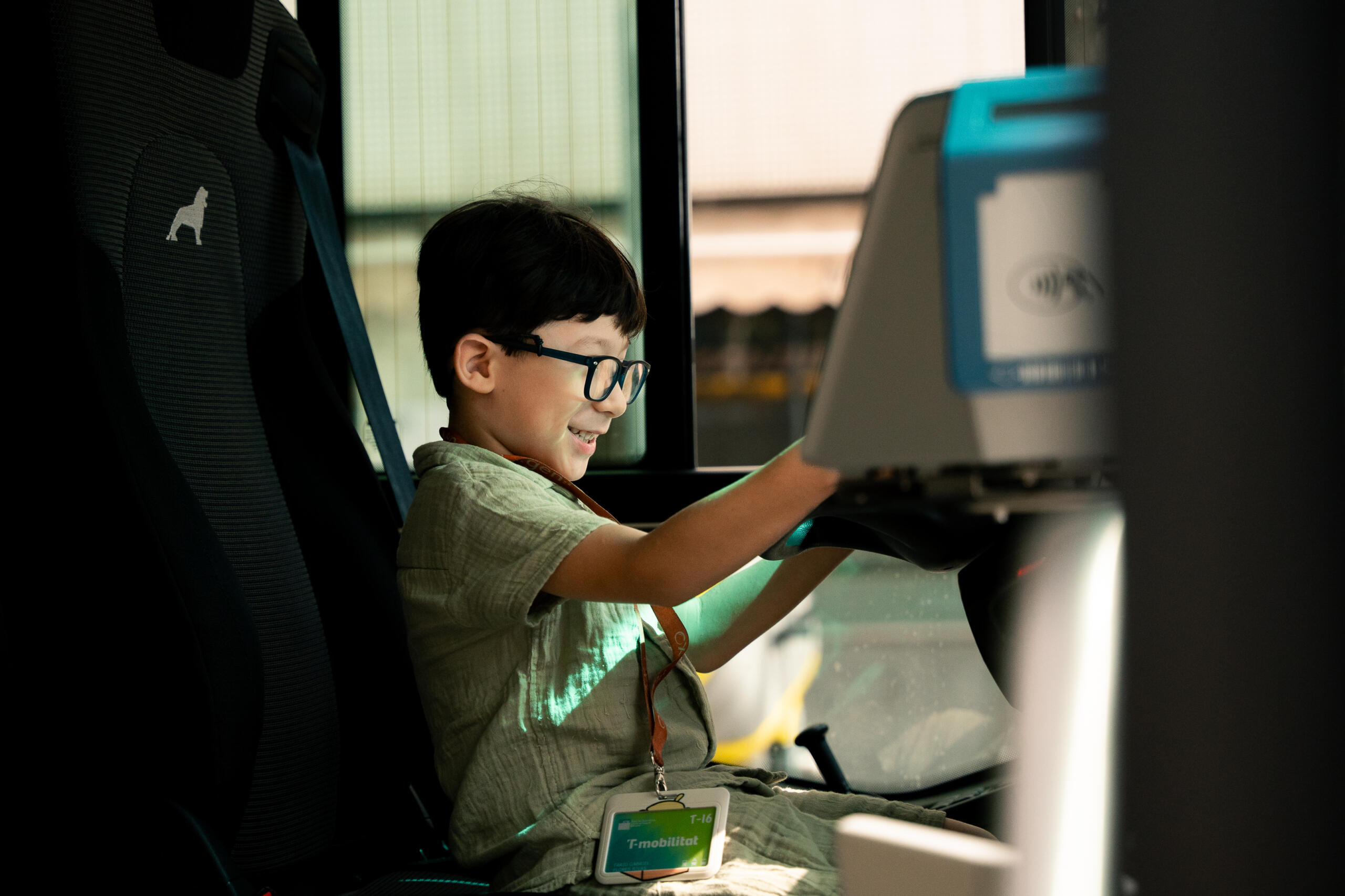 A kid on the driving seat of a bus in Hospitalet de Llobregat