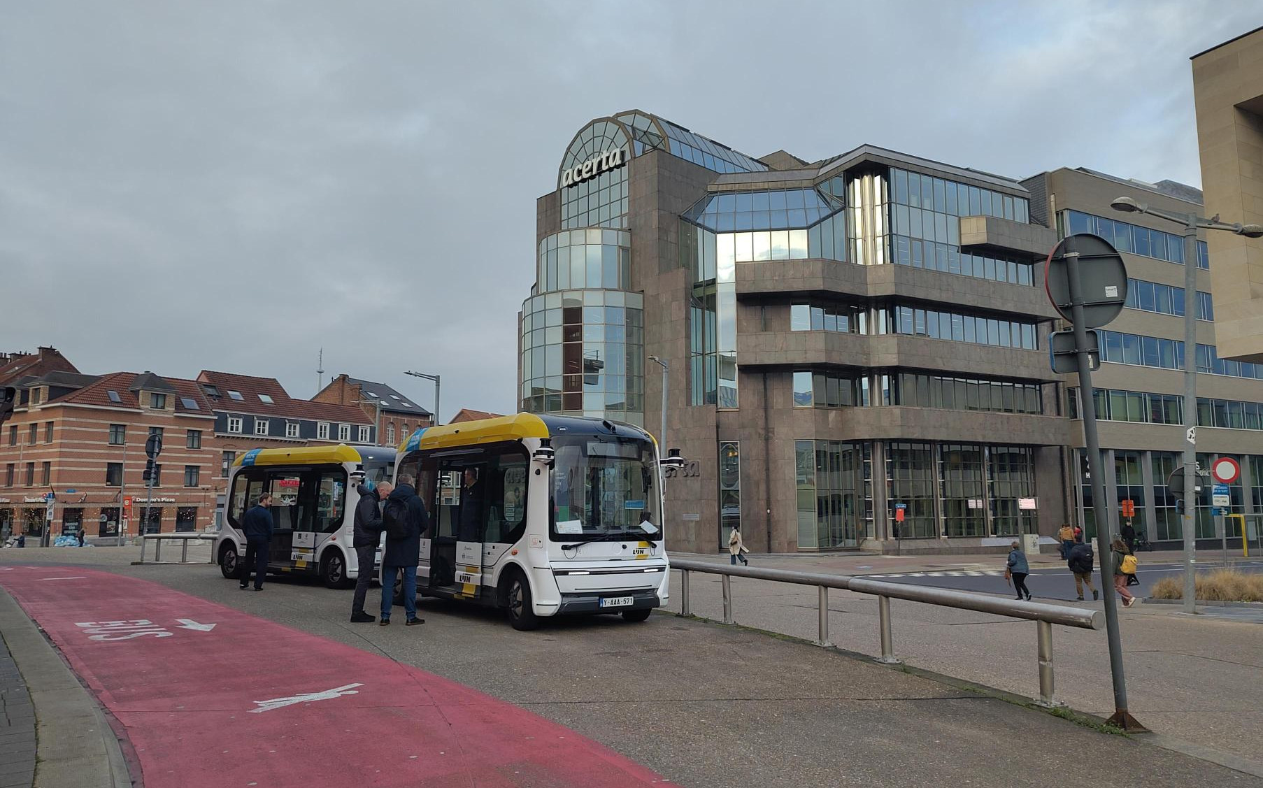 Photo of the autonomous shuttle parked on the side of the street