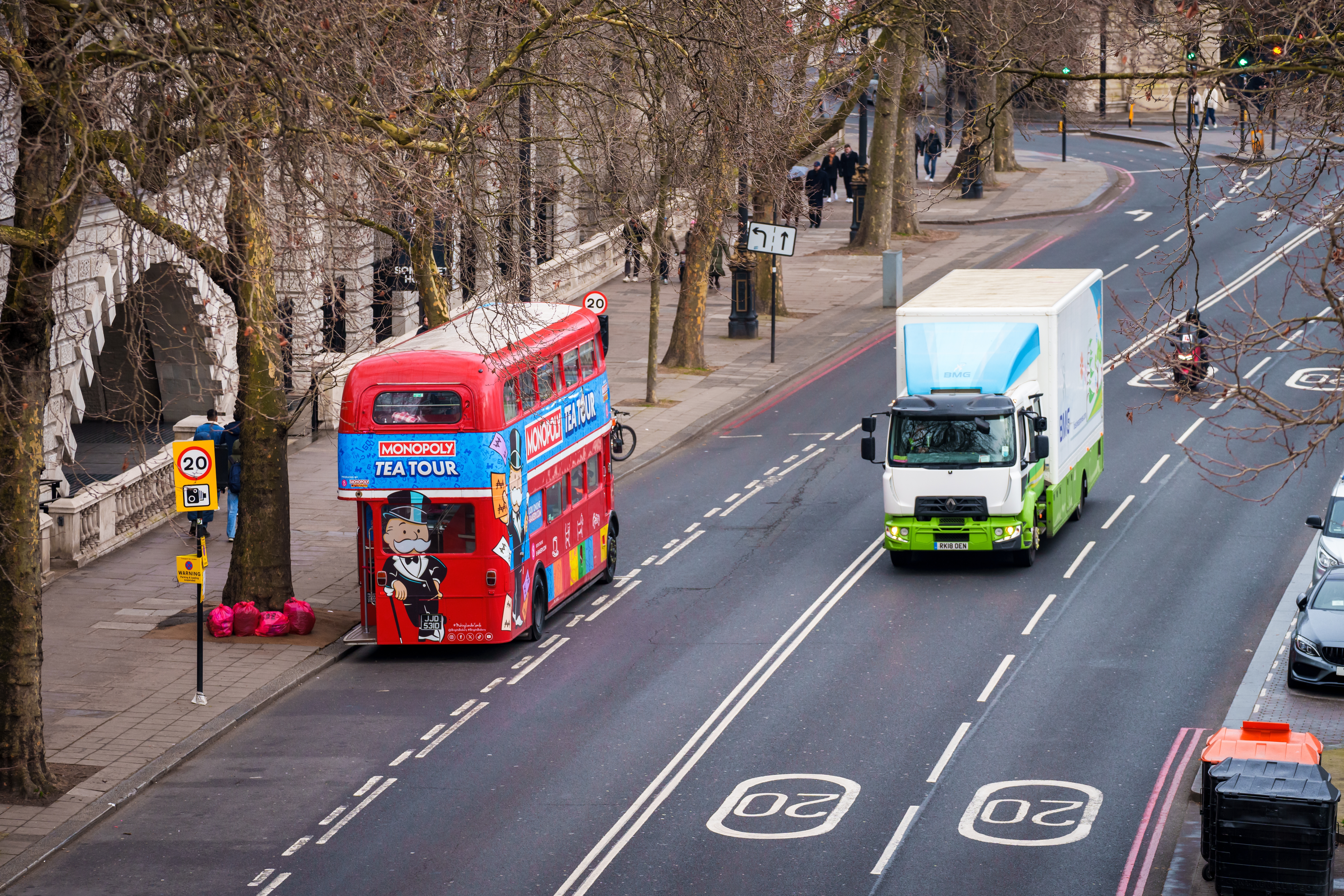20 mph street with double-deckerand delivery van in London