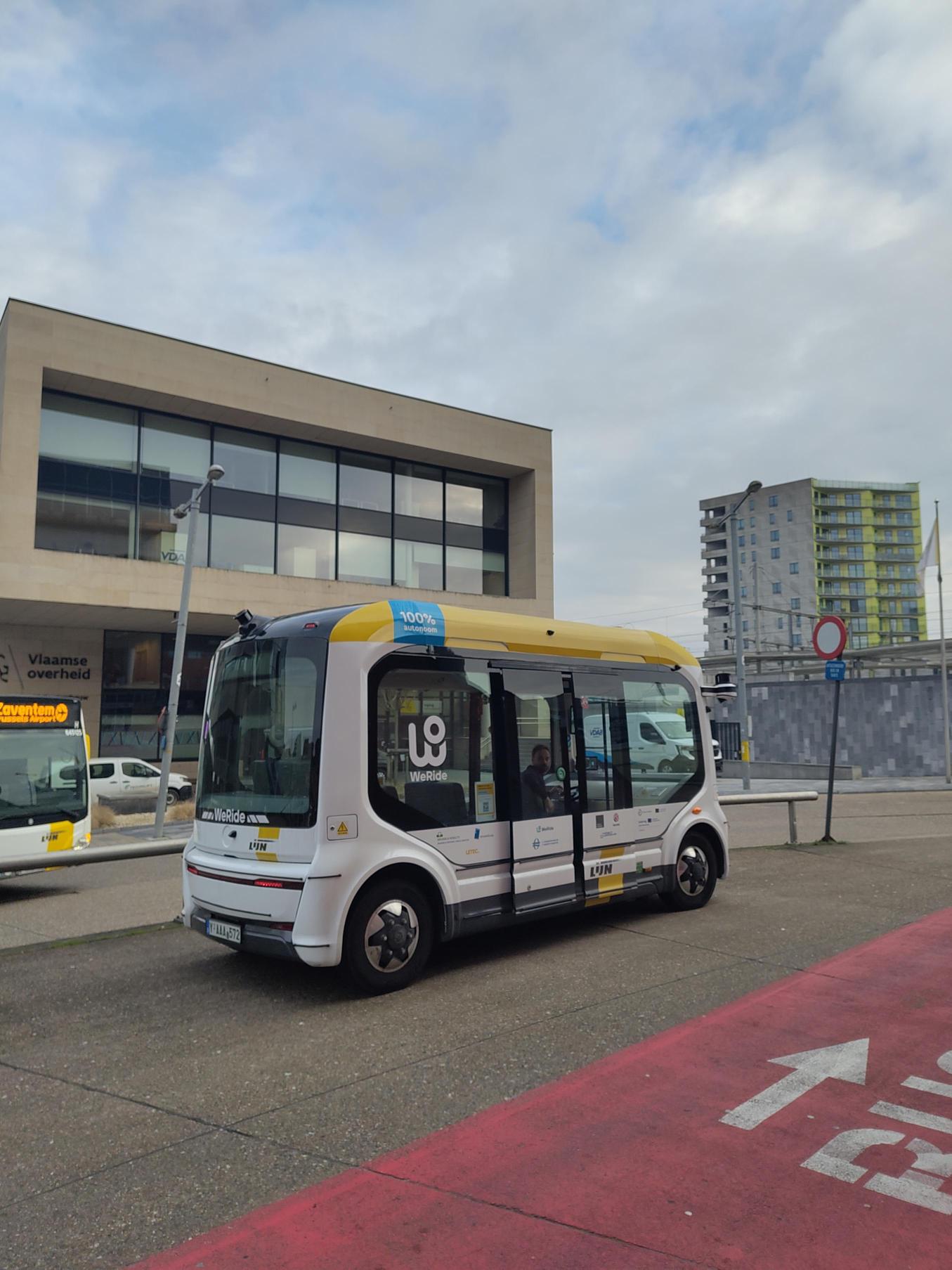 Photo of the The Leuven autonomous shuttle bus in the street