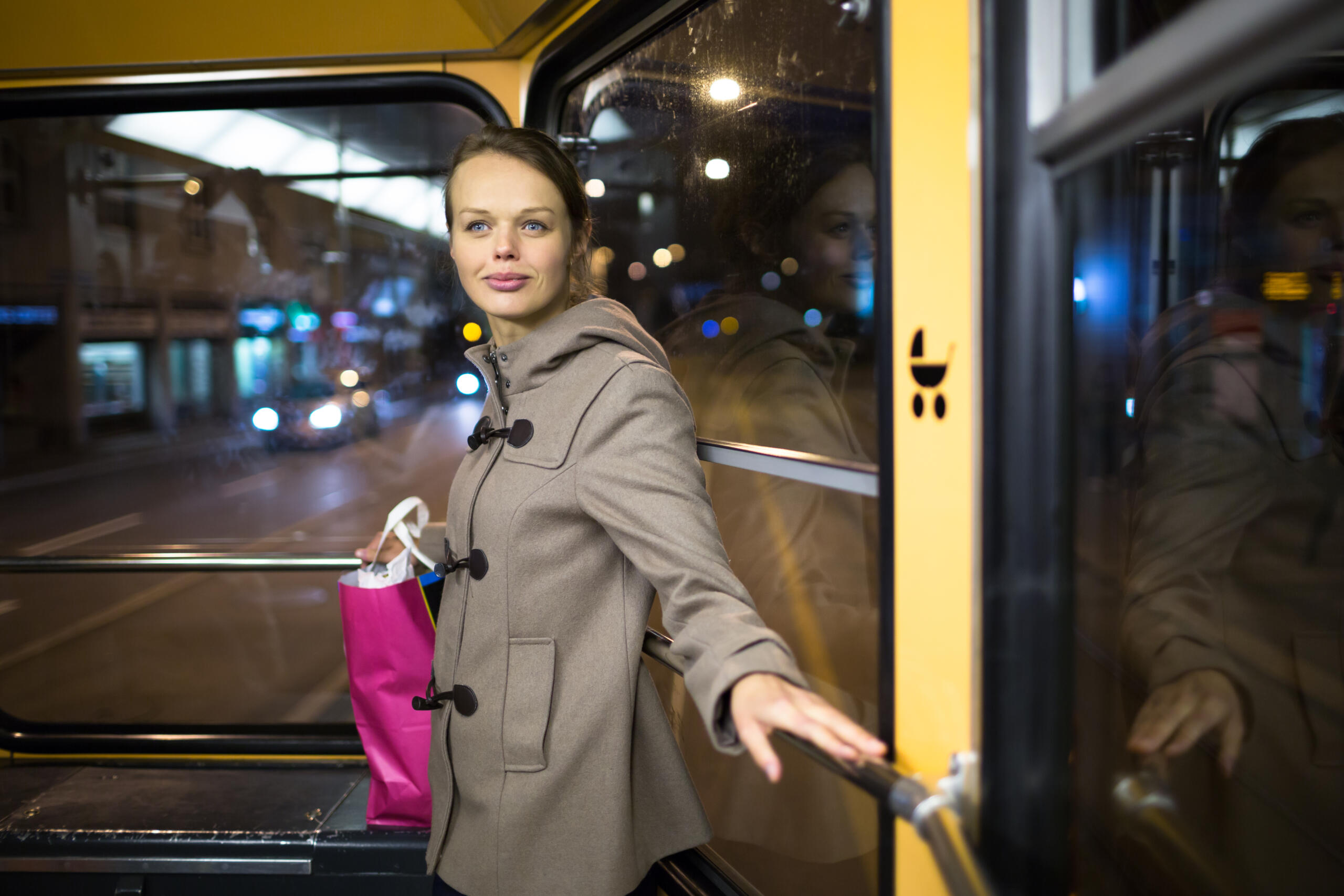 Woman on a night bus