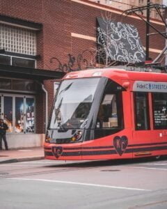 red and white tram on road during daytime