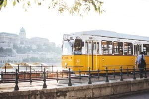 man standing in front of yellow train