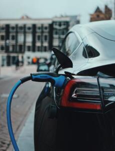 white and black car in front of white building during daytime