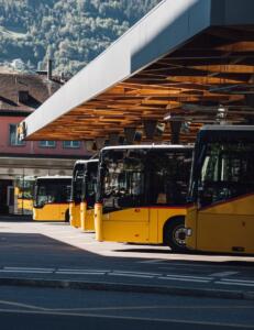 yellow bus on the road during daytime